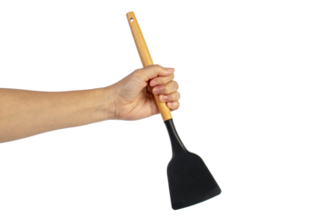 Hand with Black plastic kitchen spatula, kitchenware for cooking on transparent background.