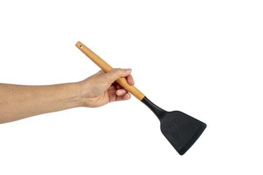 Hand with Black plastic kitchen spatula, kitchenware for cooking on transparent background. - Powered by Adobe