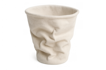 Crumpling beige disposable paper cup on transparent background, symbolizing waste, single-use, and recycling issues