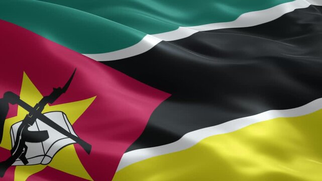 Dynamic Mozambique flag waving proudly in the wind showing its national colors and emblem, a symbol of patriotism and national pride