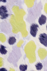 Colorful animal print pattern in purple, green, and white hues  