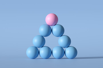 Pink sphere standing on a pyramid of blue spheres representing leadership