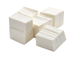A close-up view of several white soap bars with smooth surfaces and rectangular shapes arranged together