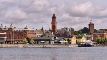 Fototapeta premium Helsingborg Cityscape With Landmark Buildings And Waterfront Views In Sweden Featuring Architecture And Urban Scenery Under Cloudy Skies