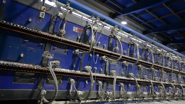 Ceramic Tile Roller Kiln. A production line or conveyor at a ceramic and porcelain tile factory. Firing. Ceramic Tile Making. Manufacturing process of ceramic tiles. Industrial kilns for Ceramics