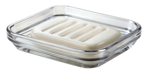 Transparent glass soap dish holding a solid bar of white soap