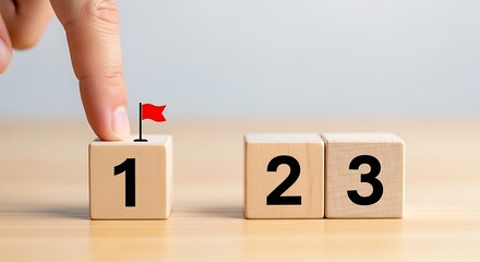 Achieving First Place Hand Placing Flag on Number One Block in a Progression