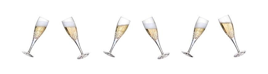 A collection of champagne glasses, flutes, tilted with fizzy wine as a birthday or New Year celebration with fizzy frothy bubbles with different fill levels isolated on a transparent background.