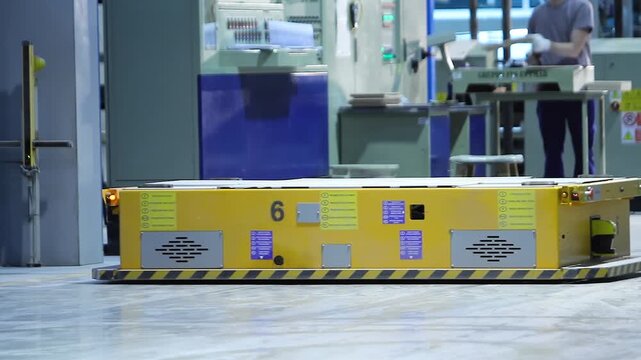 Factory for the production of ceramic tiles. Autonomous guided vehicles and Autonomous Mobile Platform transport products in a large manufacturing plant, indoor. Smart Industry. Interior. 