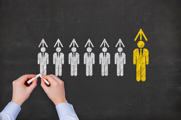 Business leadership skills and development concept Drawing businesspeople and growth arrows on chalkboard
