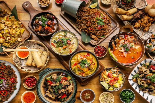 many different thai food dishes on table in modern restaurant in bangkok thailand