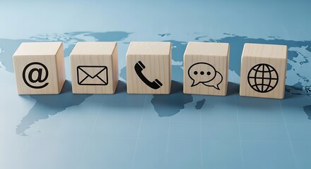 Business contact and communication methods shown with icons on wooden blocks over a world map