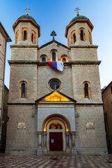 Fototapeta premium The Church of St. Nicholas a Serbian Orthodox church in the city ok Kotor at dusk. Montenegro. Vertical view.