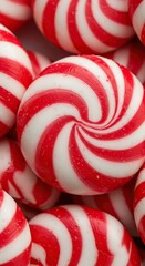 Vibrant close-up of swirled peppermint candy, showcasing its cool and refreshing essence. A classic treat with invigorating flavor ,background ,food ,pattern