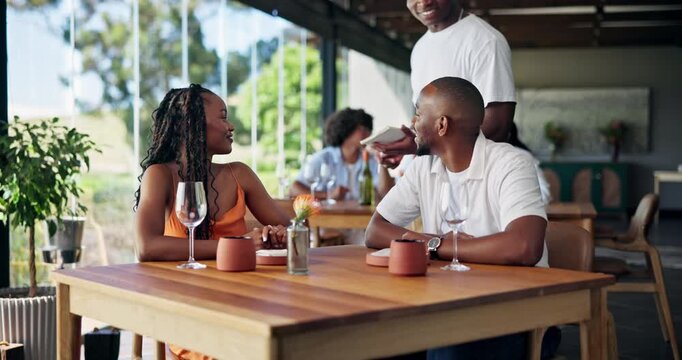 Happy couple, date or calling waiter with service in restaurant for wine, fine dining or dinner. Man, woman or smile with request for drink order, alcohol menu or anniversary together at indoor cafe