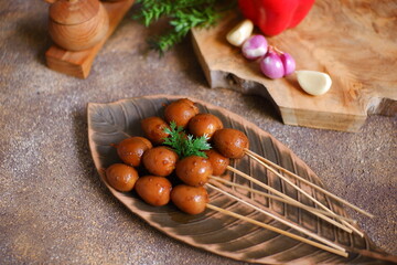 Fototapeta premium Sweet quail egg satay on a plate 