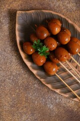 Top view of sweet quail egg satay