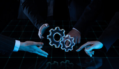 Technical artwork of hands surrounding floating gear icons on grid surface. Concept of coordinated teamwork, problem-solving, process optimization, and structured system management in tech.