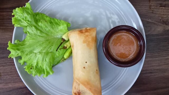 Lumpia, Fried spring roll filled with young bamboo shoots, typical of Central Java. This Indonesian fried snack is usually eaten for snacks, breakfast, and breaking the fast.