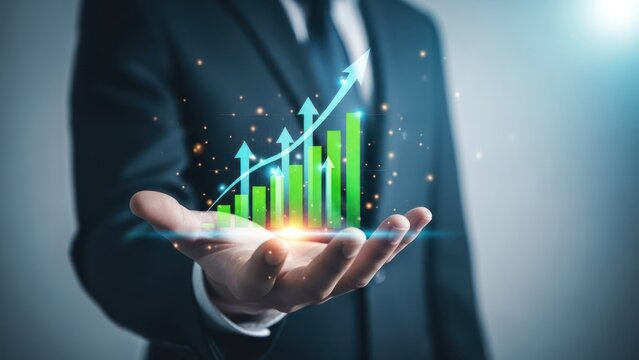 Businessman's hand displays a holographic growth chart with an upward trend arrow