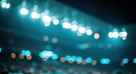 Defocused blue stage lights and warm bokeh spots above a vague, unseen crowd