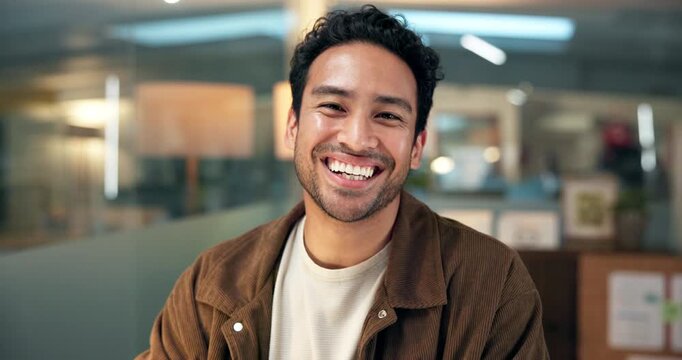 Face, laughing and night with designer man in office for development or project planning. Design, funny and reaction with creative employee in dark workplace for career pride or job satisfaction