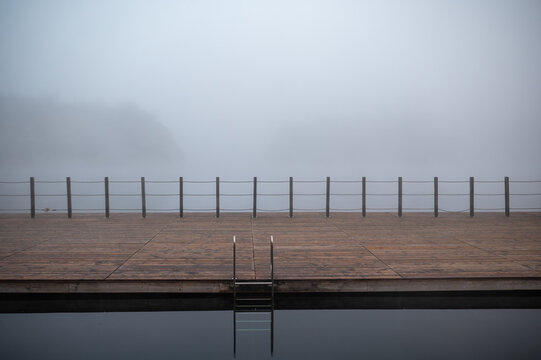 Foggy Lakeside Dock with Railing
