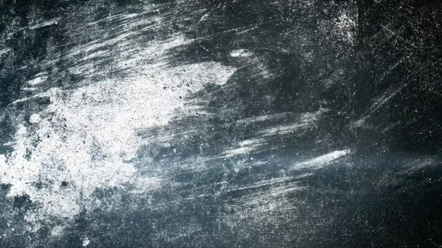 An abstract texture with scratches and a metallic sheen, conveying a sense of age and wear.