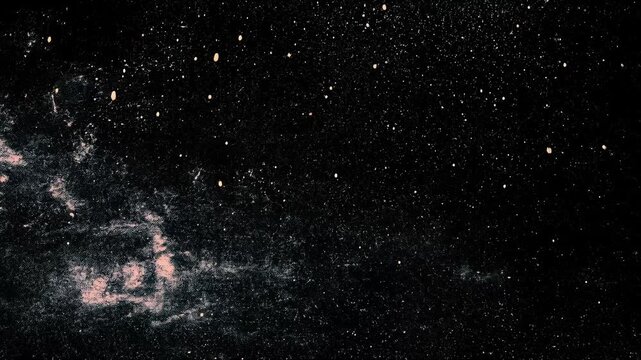 A starry night sky filled with countless stars and a hint of color from cosmic dust.