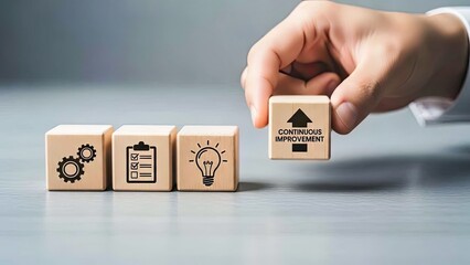 Continuous Improvement Business Strategy on Wooden Blocks Concept