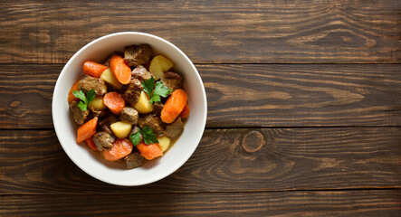 Beef meat stewed with potatoes, carrots and spices