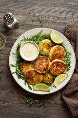Potato pancakes made from mashed potato and minced fish served with dipping sauce