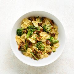 Farfalle pasta with roasted broccoli and mushrooms, top view