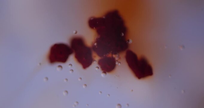 Astaxanthin Dissolving In Water Under Microscope, Strongest Antioxidant Superfood Biological Supplement, Chemical Laboratory Efficiency Research, Dietary Health Nutrition Science Concept