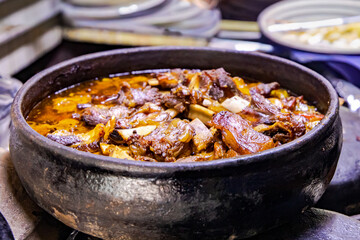 Appearance of meat cooked in the oven in a clay pot
