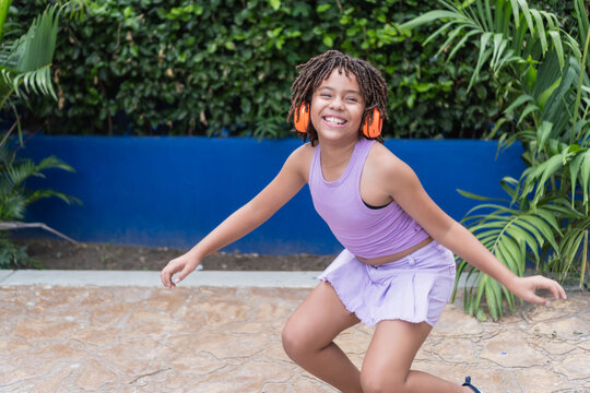 Happy girl listening to music celebrating children's day