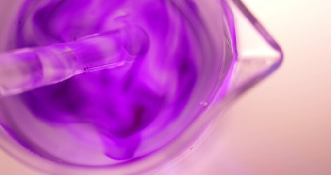 Methyl Violet (C24H28ClN3) Particles Dissolving in Water Measuring Beaker Top View, Glass Rod Stirring Chemical Solution, Laboratory Research Process, Scientific Experiment Education Study Detail