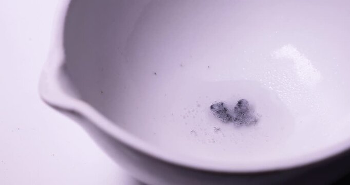 White Ceramic Bowl with Zinc (Zn) reacting with Hydrochloric Acid (HCl) Panning Shot, Producing Explosive Hydrogen (H2) Gas, Dangerous Chemical Experiment, Lab Energy Research, Hydrogen Production