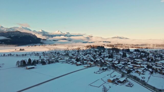 Aerial view of Schwangau with snowy mountains, Germany.