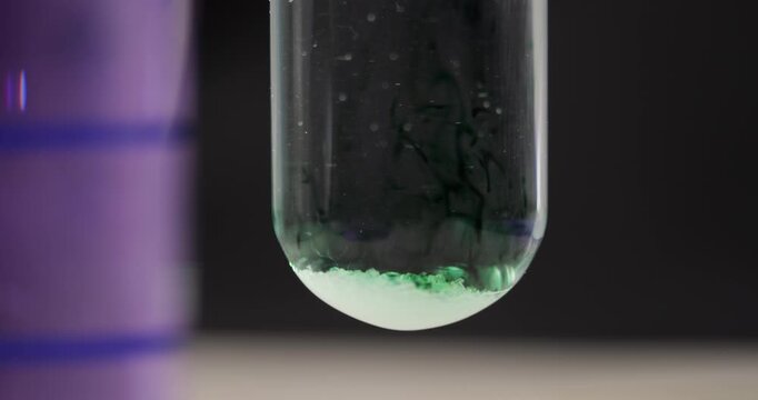 Oxalic Acid (C2H2O4) reacting with Methyl Violet (C24H28ClN3) forming Green Color Solution, Unexpected Chemical Result, Scientific Laboratory Experiment, Color Change Reaction Research Study
