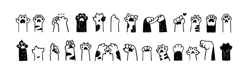 Doodle set of cute cats' paws with pads. Funny scribbles of kittens' hands showing different gestures: heart, thumb up, sign of peace. Hand drawn outline isolated vector illustrations on white © Paper Trident
