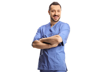 Male healthcare worker in a blue uniform posing with crossed arms