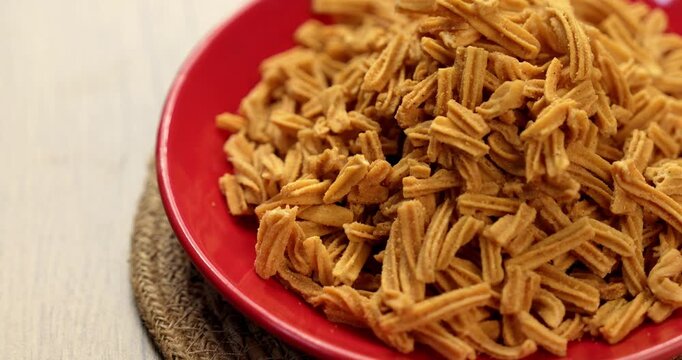 Crispy soya stick snack served in a bowl, healthy high-protein Indian namkeen for tea time or evening munching