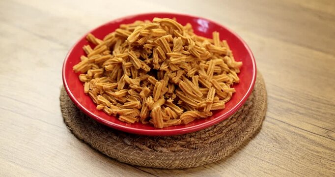 Crispy soya stick snack served in a bowl, healthy high-protein Indian namkeen for tea time or evening munching