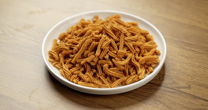 Crispy soya stick snack served in a bowl, healthy high-protein Indian namkeen for tea time or evening munching