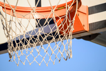Close Up Of White Basketball Net Against Blue Sky.