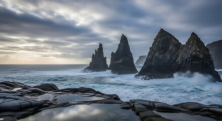 Coastal sea stacks with ocean waves and rocky shore