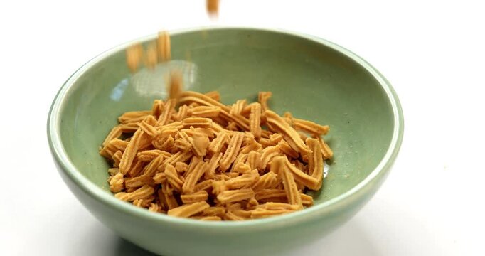 Crispy soya stick snack served in a bowl, healthy high-protein Indian namkeen for tea time or evening munching
