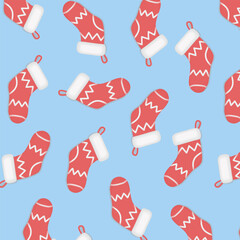 Cute flat vector seamless pattern of red Christmas stockings with white cuffs and loops scattered on light blue background. Festive holiday repeating motif perfect for wrapping paper, textiles.