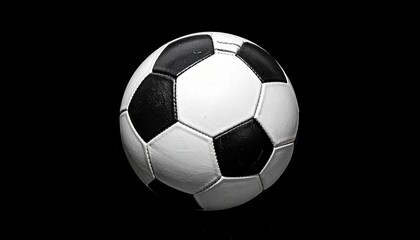 Naklejka premium Classic soccer ball on black background
